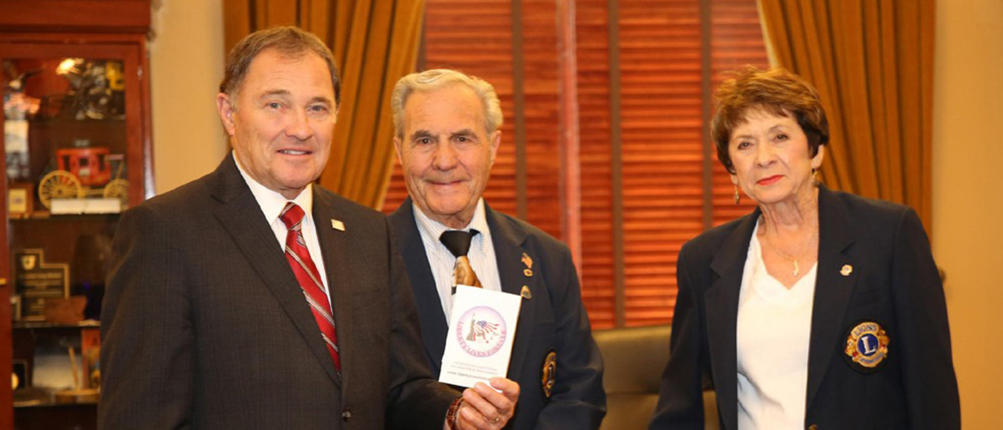 Governor Herberts of Utah and two members of the lions club